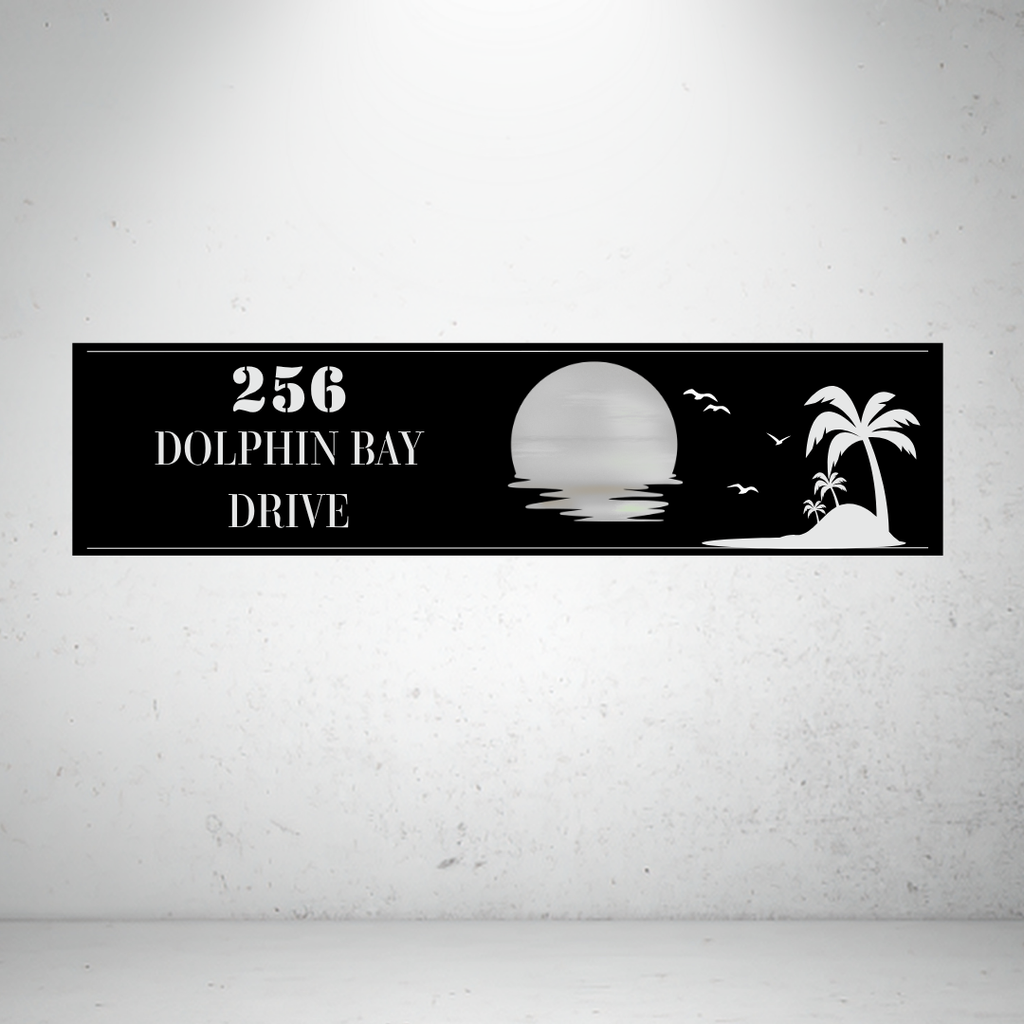 Metal house number sign with sunset and palm tree design on a grey background