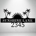 Metal house number sign with tropical palm tree design on a grey background