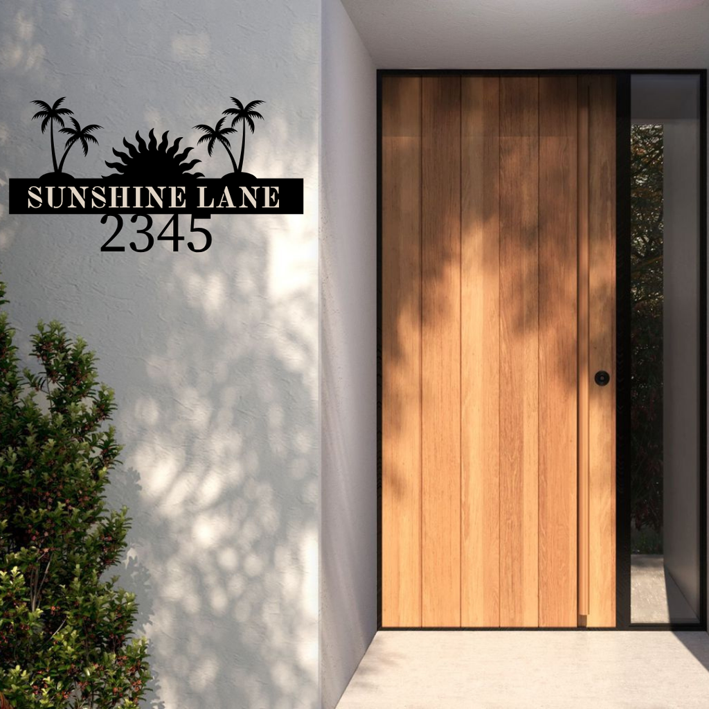 Metal house number palm tree address sign installed at a beach-style home entrance