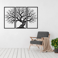 Timeless Roots three-panel tree metal wall art displayed above a contemporary chair in a modern interior