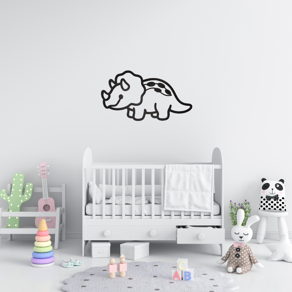 Tiny Triceratops | Dinosaur Metal Wall Art showcased above a baby cot in a contemporary nursery.
