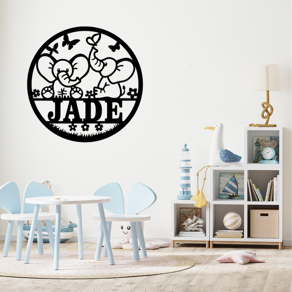 Cute elephant wall décor styled above a neutral nursery crib