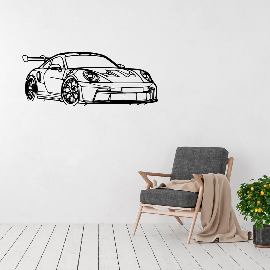 Track Legend Porsche 911 GT3 RS metal wall art displayed above a modern accent chair in a contemporary living room.