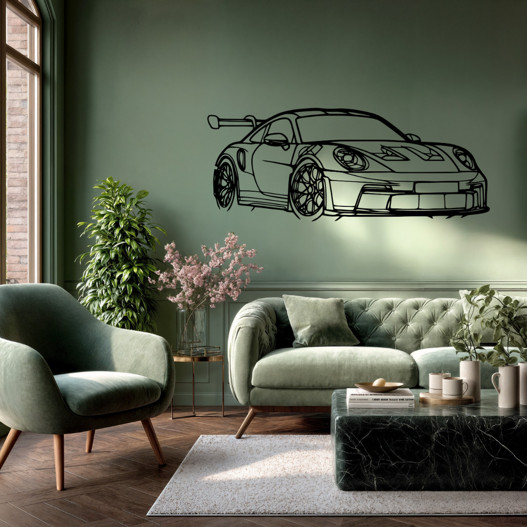Track Legend Porsche 911 GT3 RS metal wall art mounted above a green sofa in a stylish modern lounge.