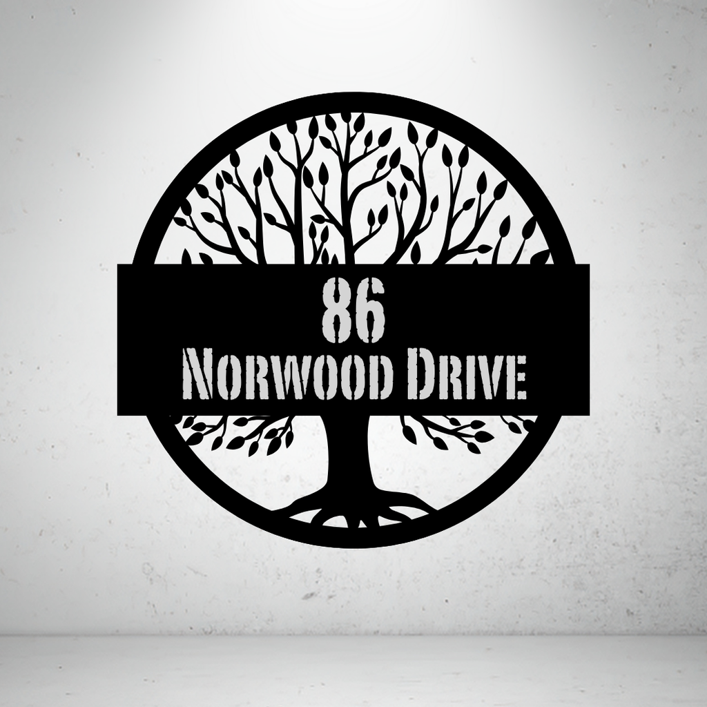 Metal house number sign with tree silhouette design on a grey background
