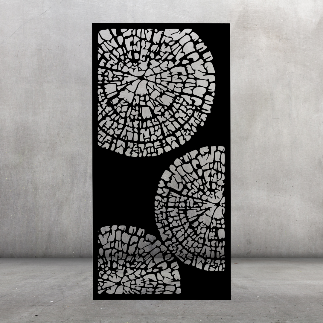 Tree Rings metal privacy screen displayed against a dark grey wall with flowing circular shapes and nature-inspired design