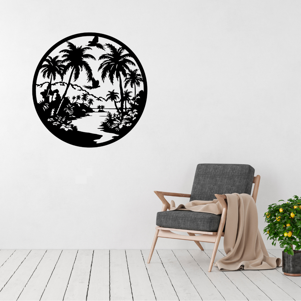 Tropical Paradise Escape | Palm Oasis Metal Wall Art displayed on a modern living room wall above a grey accent chair, featuring a tropical landscape with palm trees, birds, and a peaceful river in black powder-coated metal.