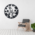 Tropical Parrot Paradise metal wall art featuring a parrot and tropical foliage displayed above a contemporary chair