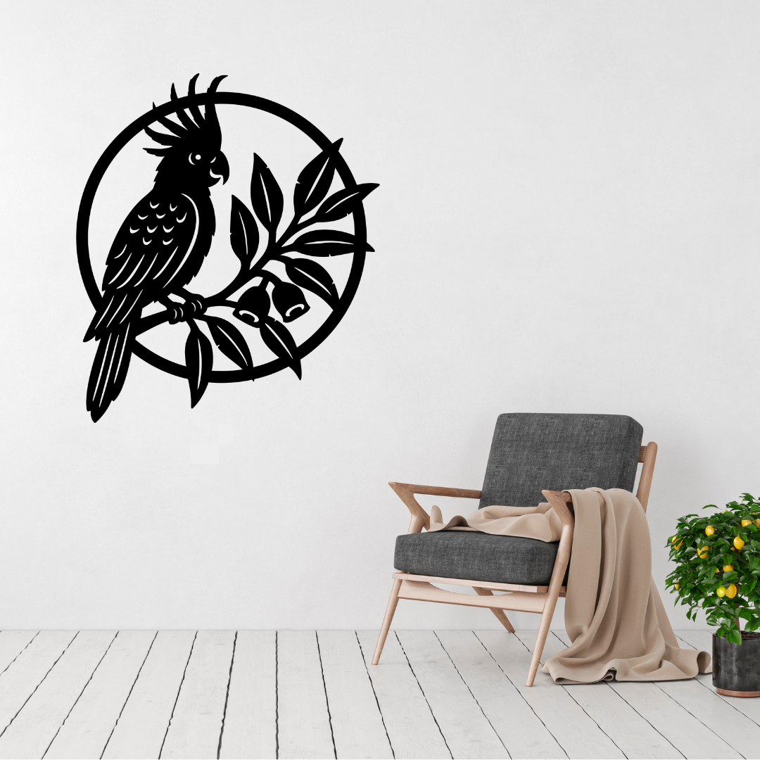 Tropical Perch cockatoo and botanical metal wall art displayed above a contemporary chair in a modern interior