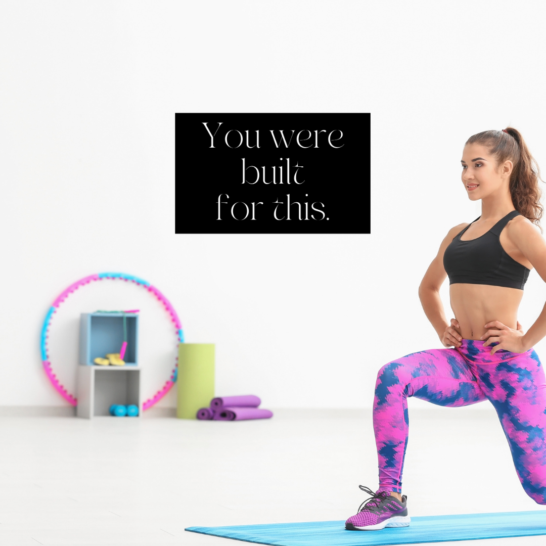 Unstoppable Fitness Inspired | You're Built For This Metal Wall Art displayed in a home gym beside workout equipment.