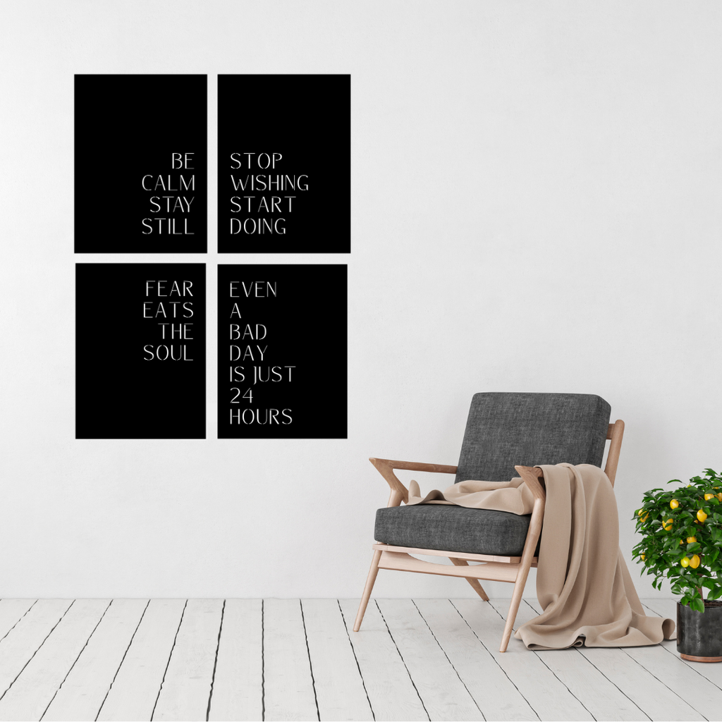 Unstoppable Mindset motivational typography metal wall art set displayed above a modern lounge chair, featuring four inspirational quote panels in a minimalist layout.