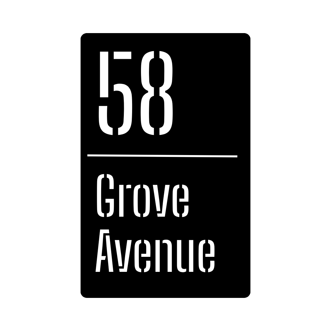 Metal house number plaque isolated on a plain white background with vertical layout