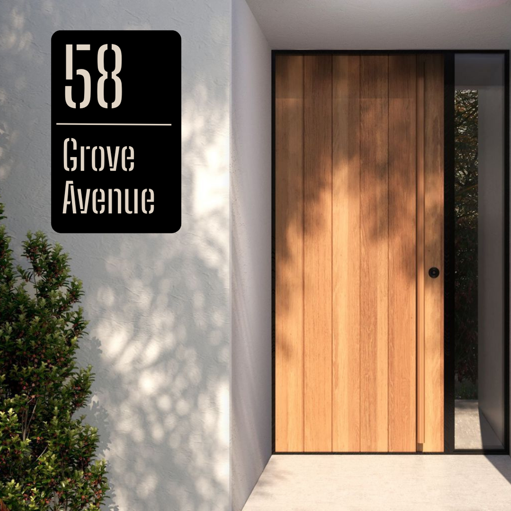 Metal house number vertical address sign installed at a contemporary home entrance