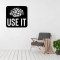 Use It | Brain Motivation Metal Wall Art displayed in a modern office setting.