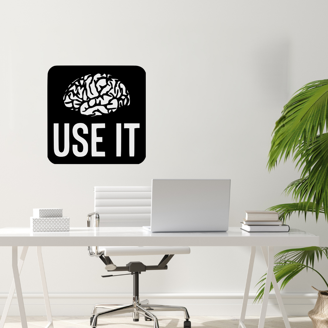 Use It | Brain Motivation Metal Wall Art showcased above a contemporary office desk.