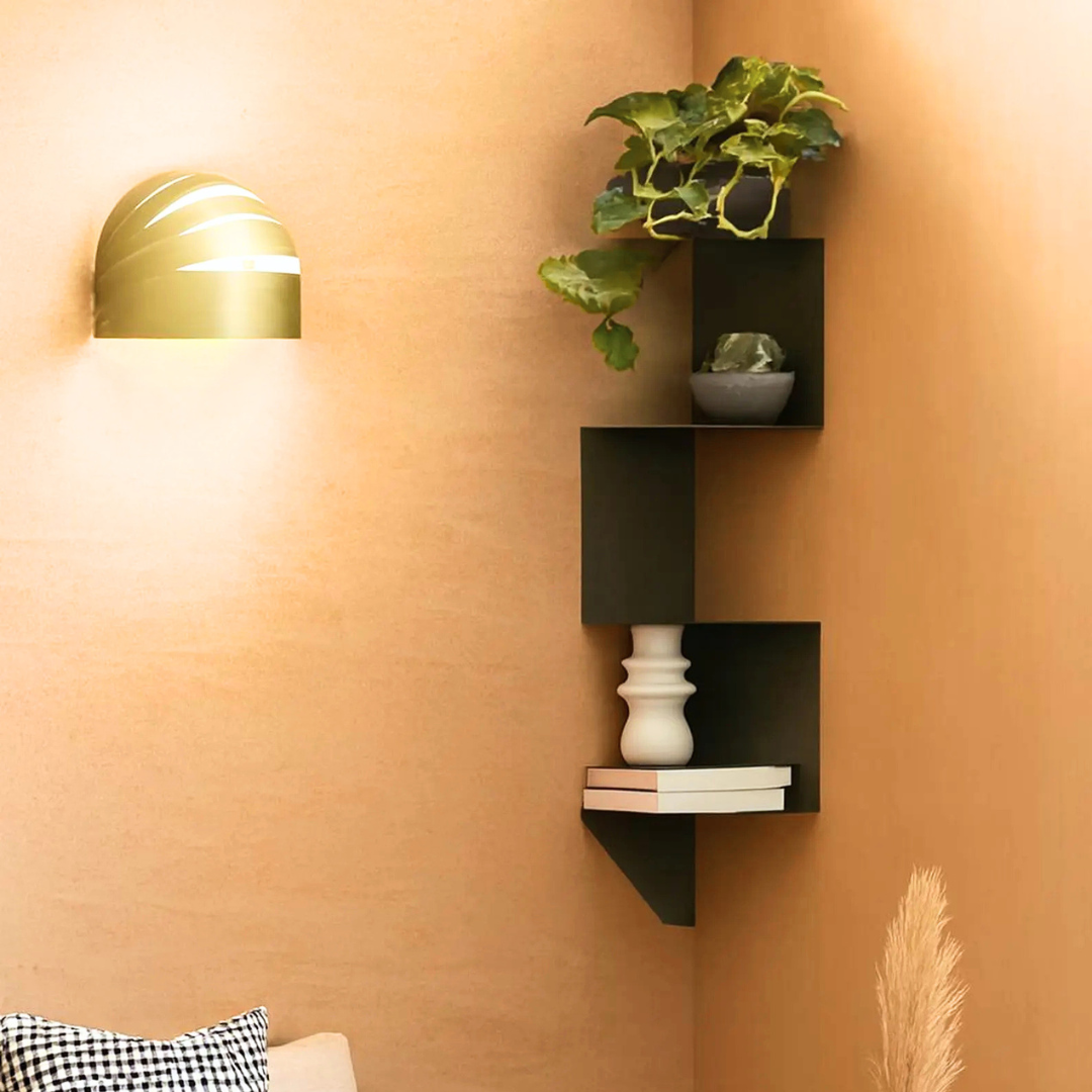 Modern corner shelf displaying plants and decorative accessories in a contemporary living room