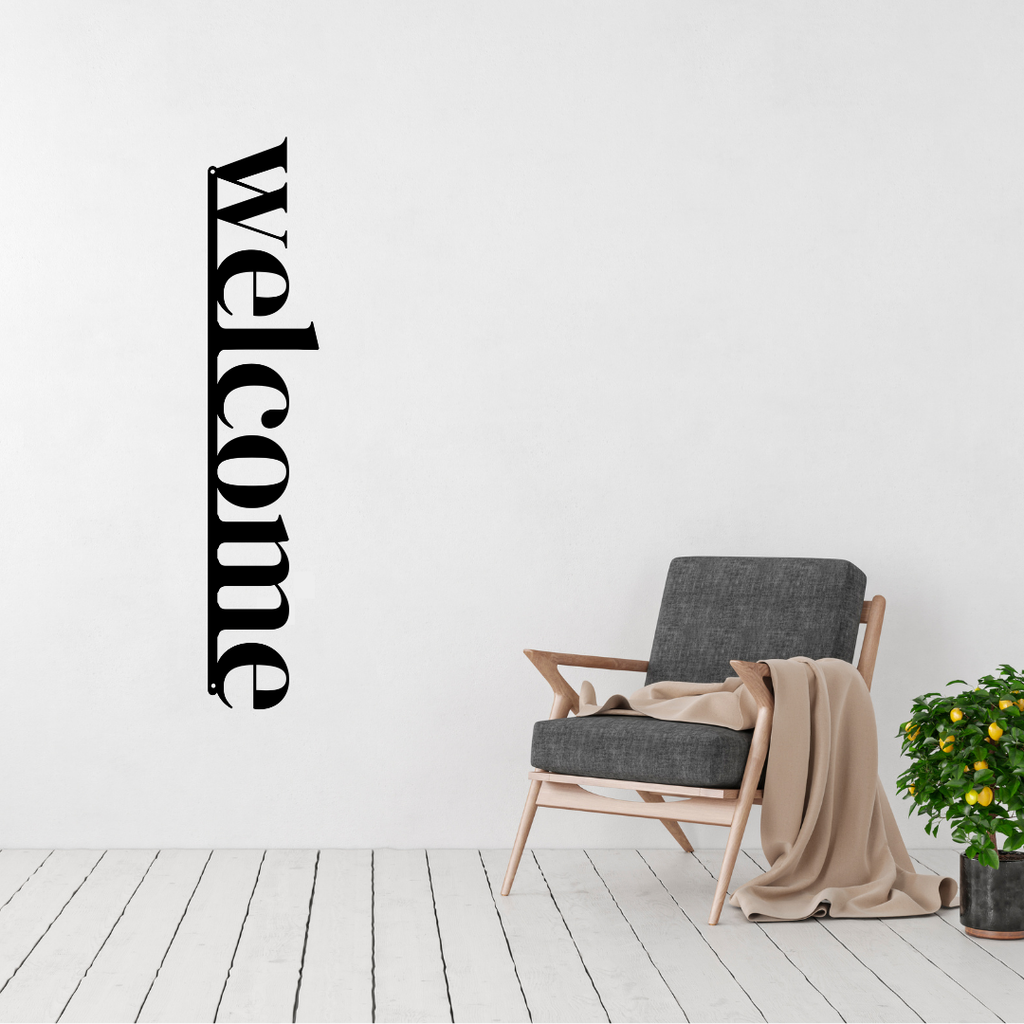 Warm Welcome | Welcome Metal Wall Sign displayed in a modern living room.