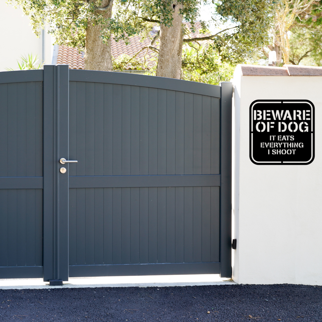 Warning Bite | Beware of Dog Metal Sign mounted beside a modern entrance gate.
