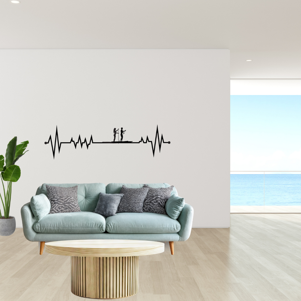 Waterbound Paddle Board | His & Hers SUP Heartbeat Metal Wall Art showcased above a sofa in a contemporary living room.