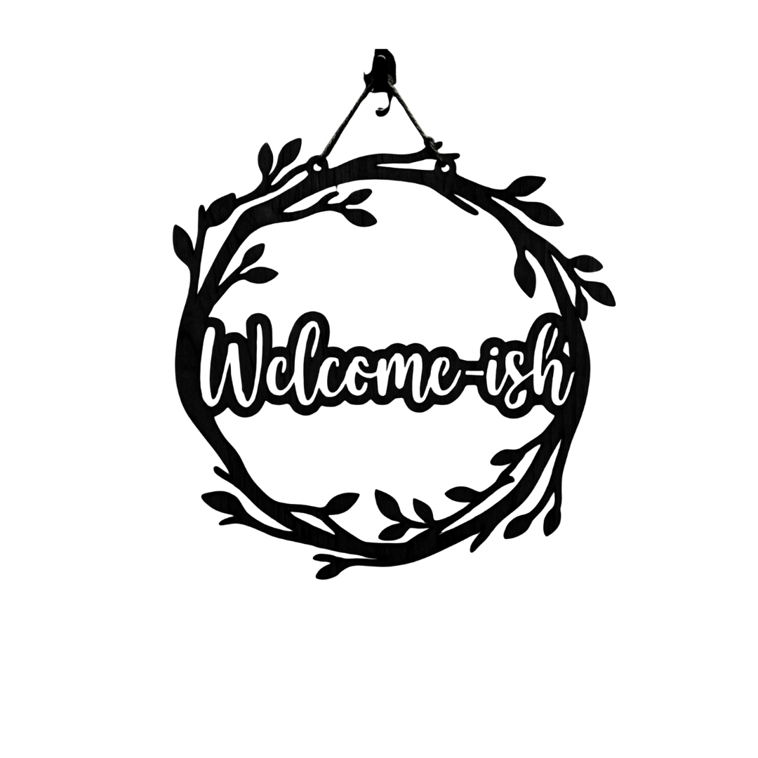 Welcome-ish | Humorous Metal Welcome Sign featuring a decorative botanical wreath with the witty "Welcome-ish" phrase.