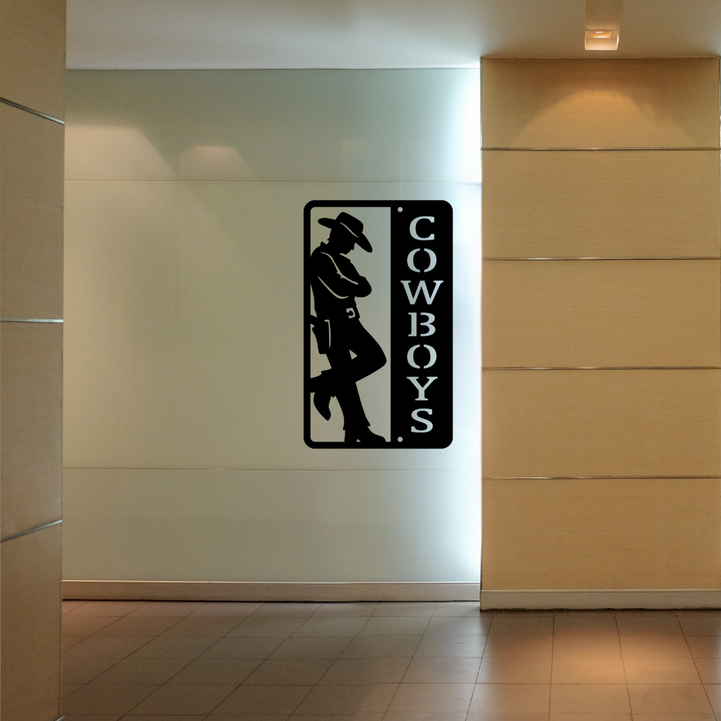 Western Trails | Cowboys Bathroom Metal Wall Sign mounted in a contemporary commercial hallway.