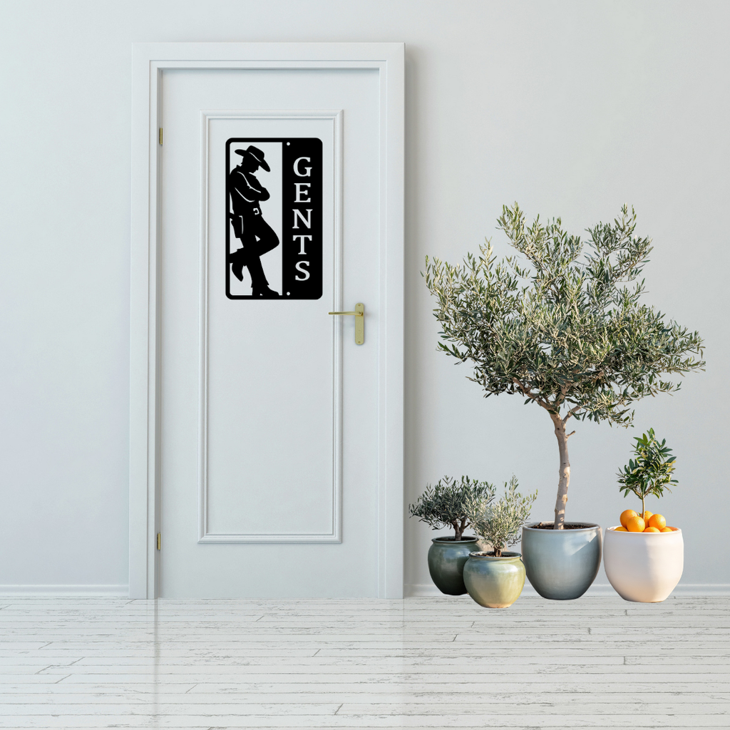 Western Trails | Gents Western Bathroom Metal Sign displayed on a modern white bathroom door.