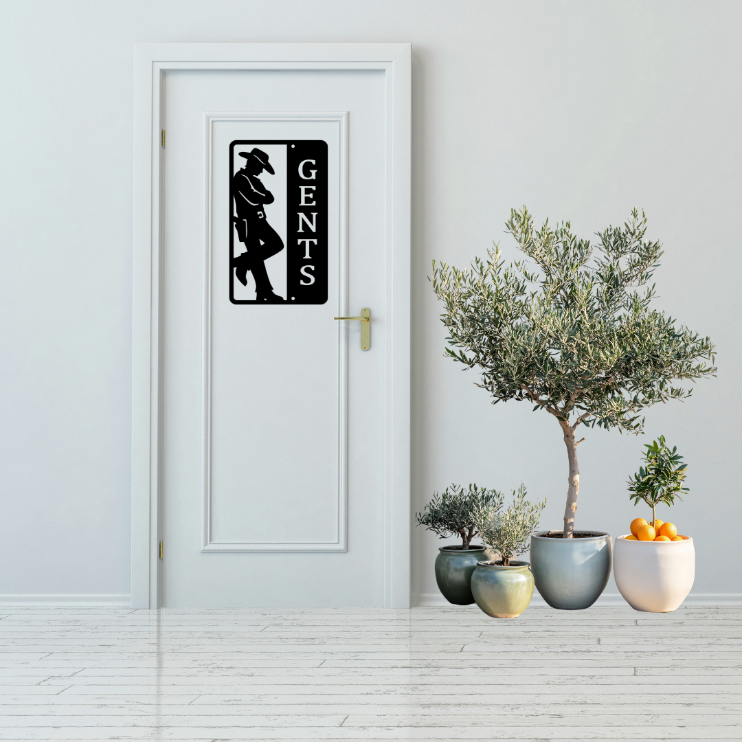 Western Trails | Gents Western Bathroom Metal Sign displayed on a modern white bathroom door.