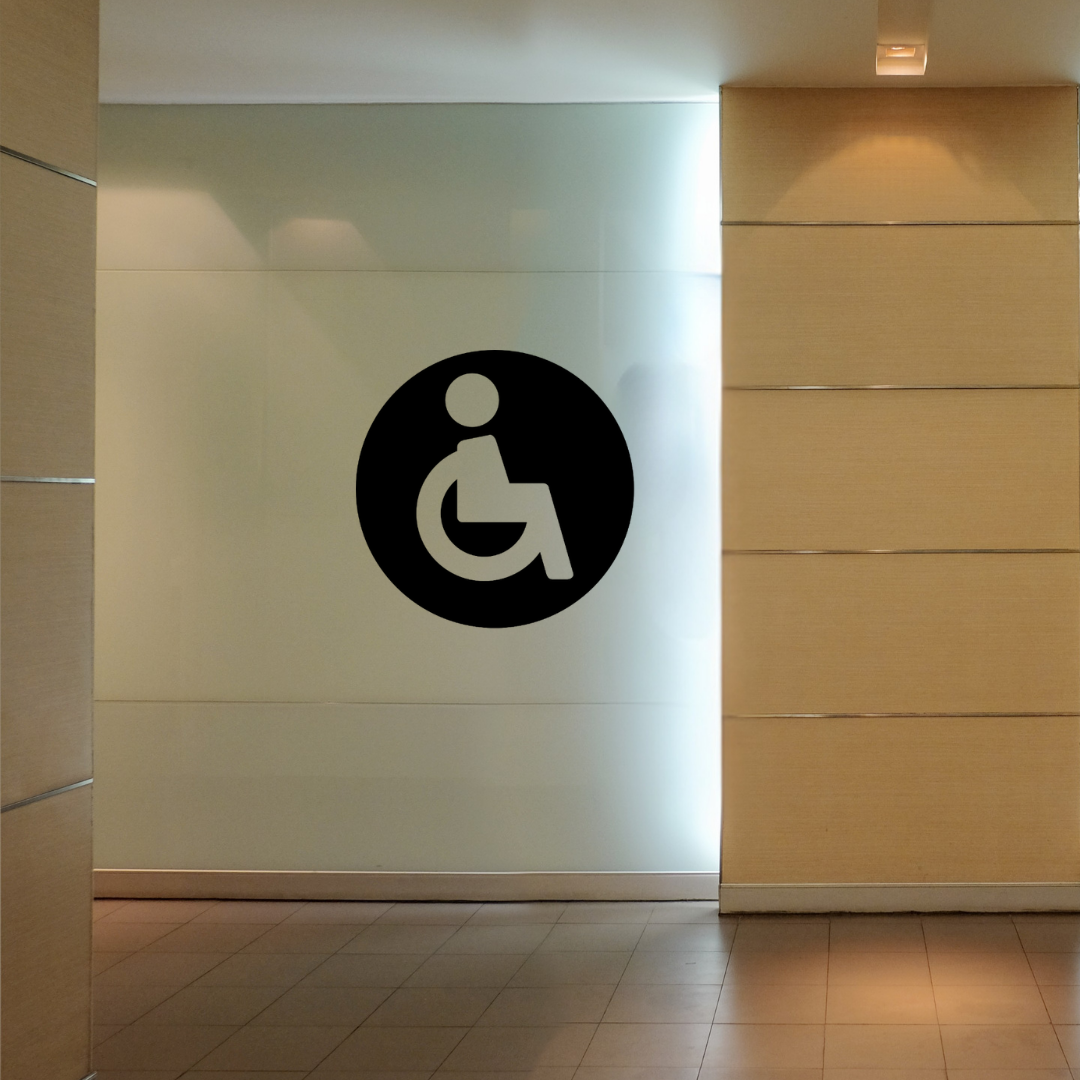 Wheelchair Accessible Toilet Sign | Metal Bathroom Sign mounted on a contemporary restroom wall.