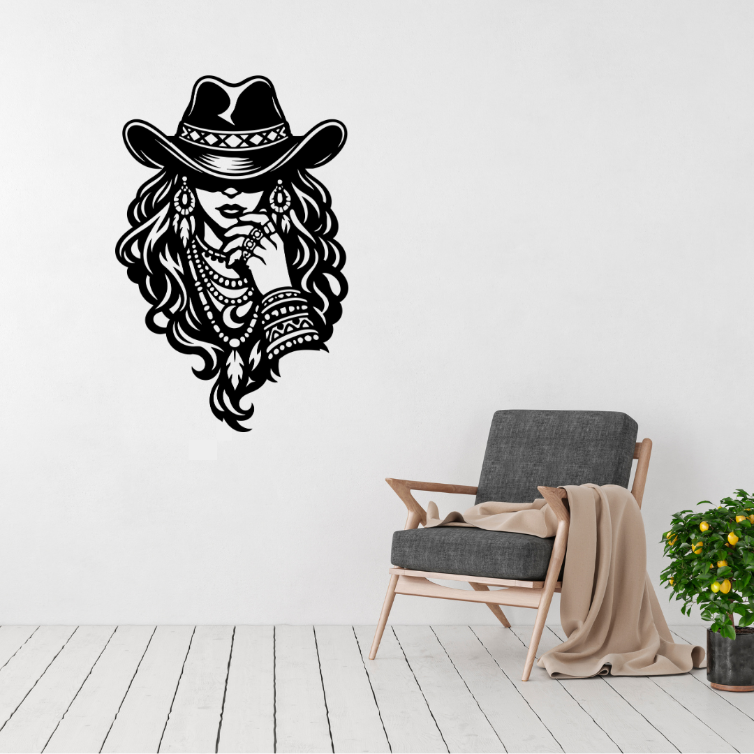 Wild and Free bohemian cowgirl metal wall art displayed above a contemporary chair