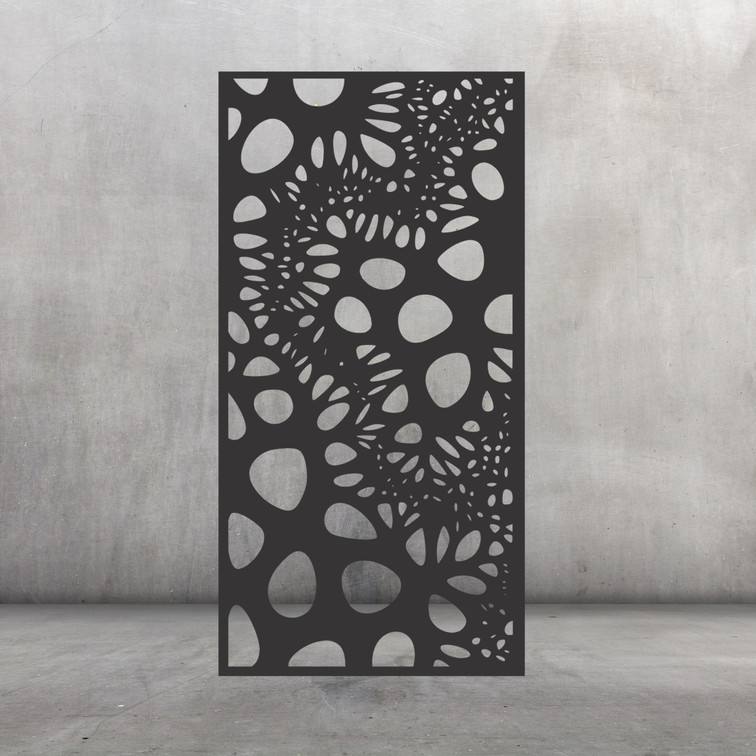 Wildwood botanical metal privacy screen displayed against a dark grey wall with flowing leaf and foliage-inspired cut-outs