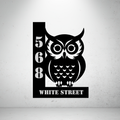 Metal house number sign with owl design on a grey background for modern home décor