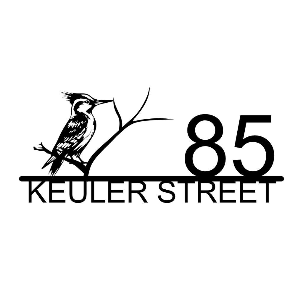 Metal house number plaque with bird silhouette isolated on a plain white background