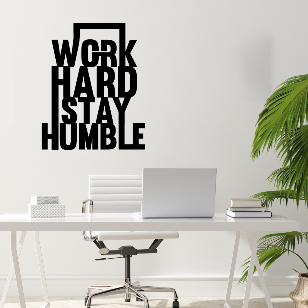 Work Hard Stay Humble | Motivational Metal Wall Art showcased above a minimalist office desk.
