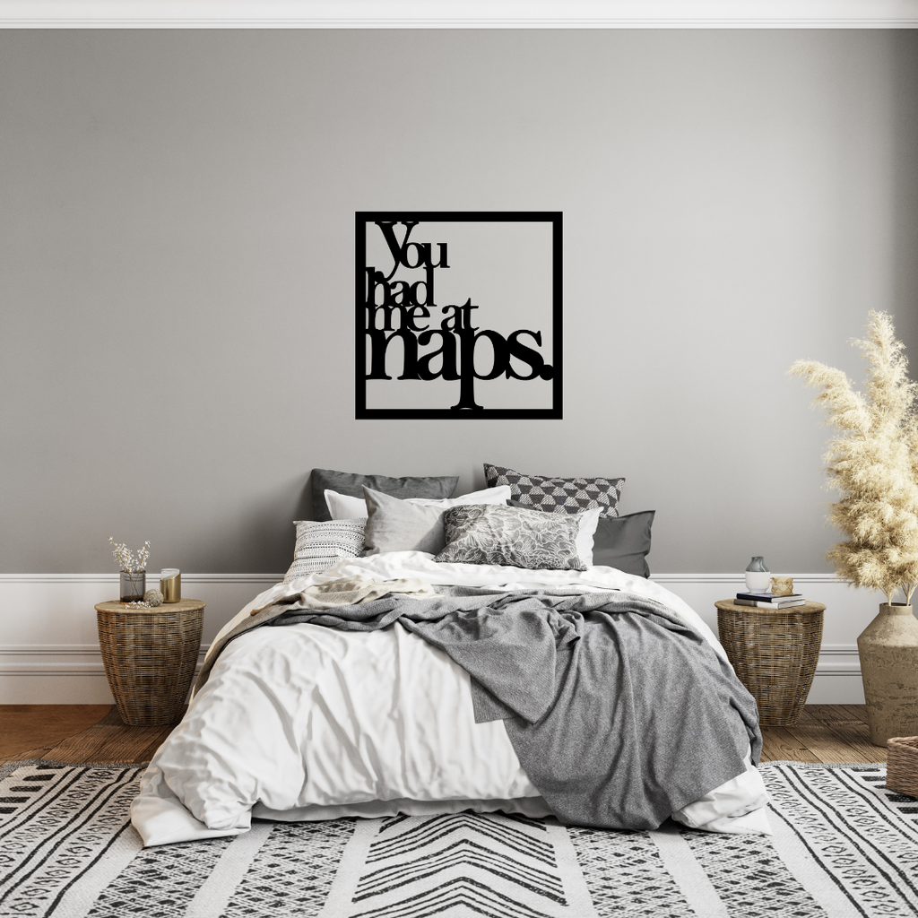 You Had Me at Naps | Funny Sleep Metal Wall Art showcased above a stylish bed in a modern bedroom.